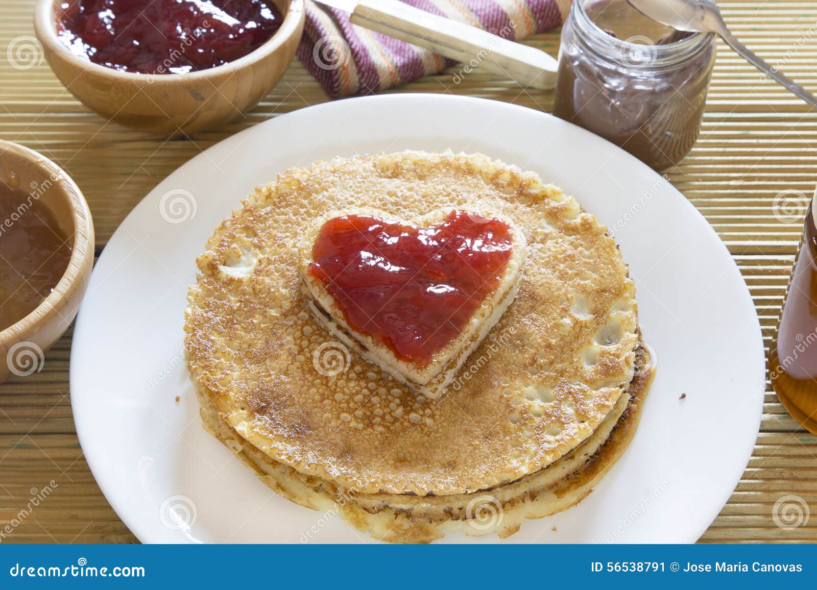 Heart Shaped Pancake with Strawberry Jam on Stack of Pancakes Stock ...