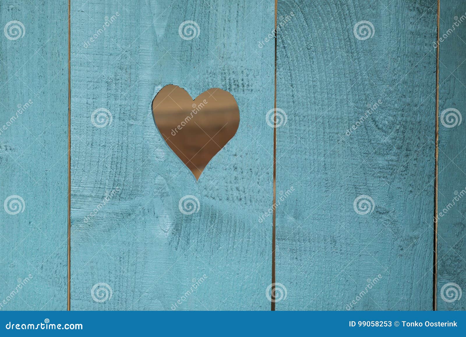 Patterns And Designs Of Green Wooden Heart On Blue Background With