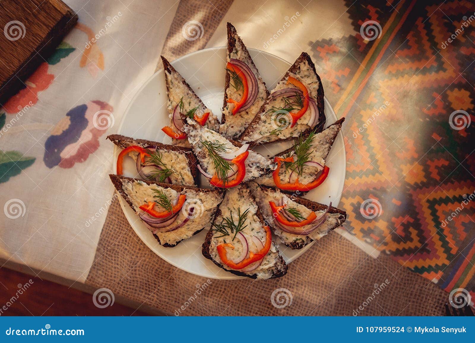 Hearty Lard with Garlic Served with Fresh Bread on a Table. Stock Photo