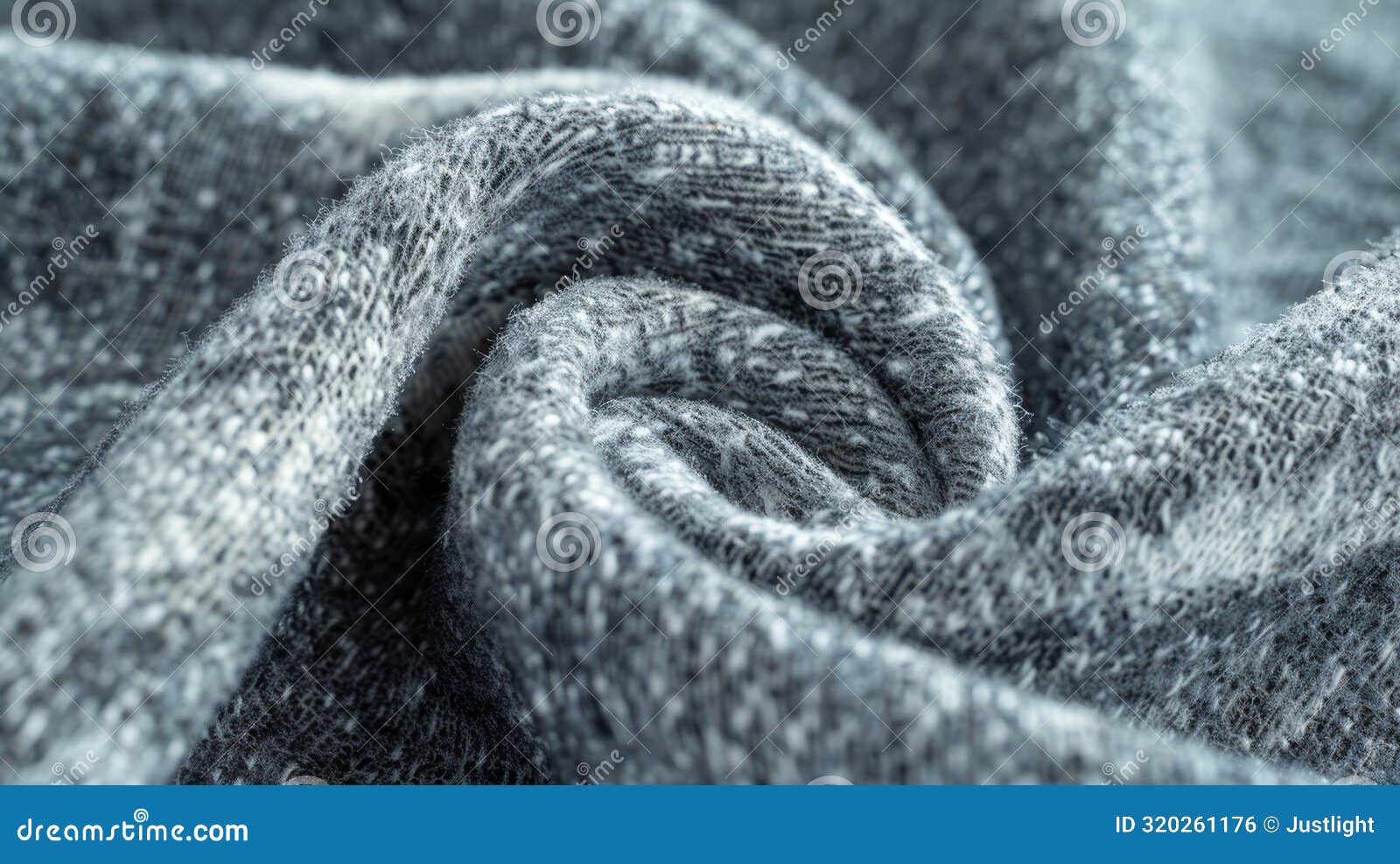 heathered texture of brushed fleece in shades of grey and white creating a subtle speckled effect