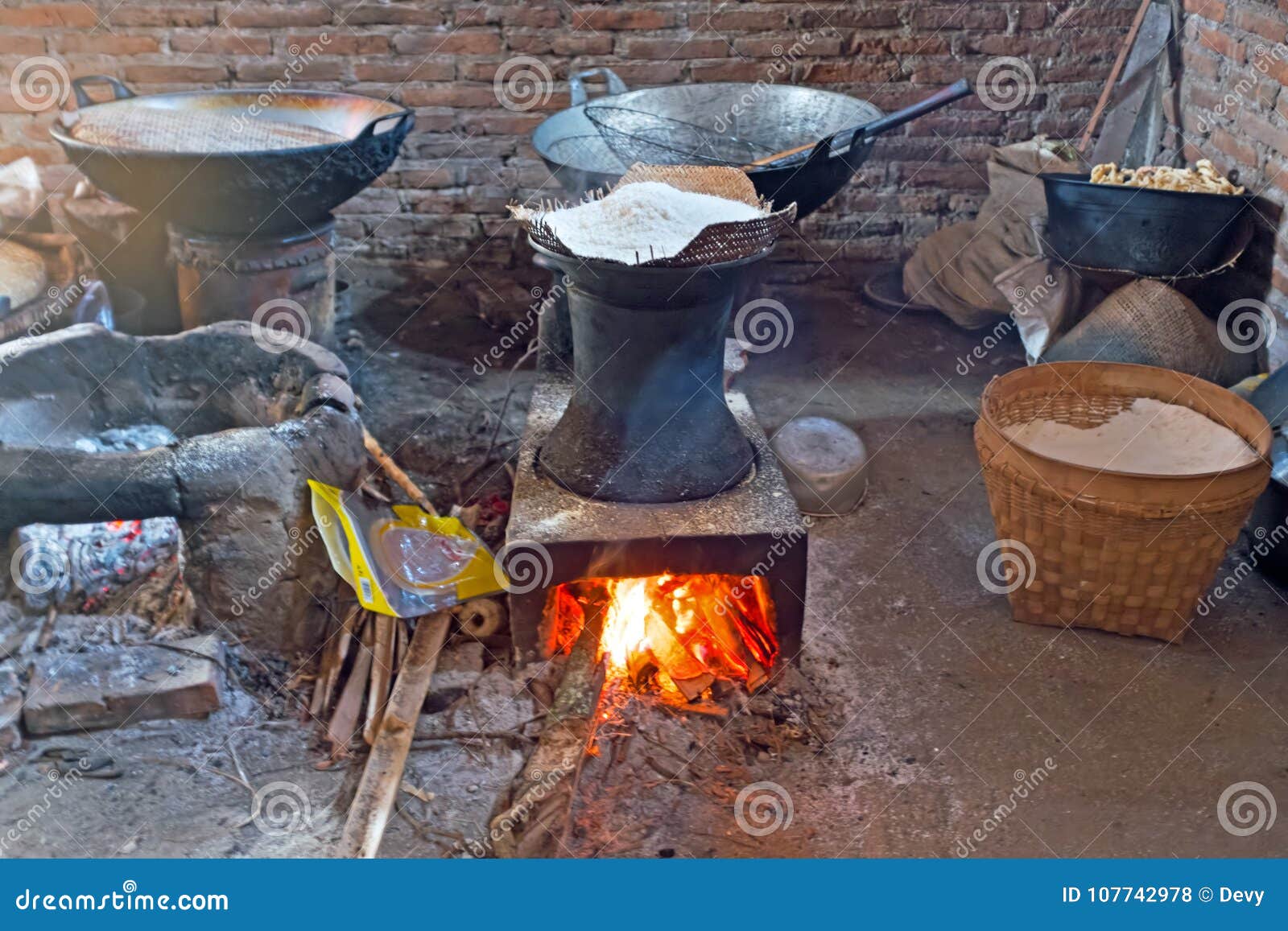 Heating Dough on a Fire To Make Spaghetti in an Old Fashioned Way Stock