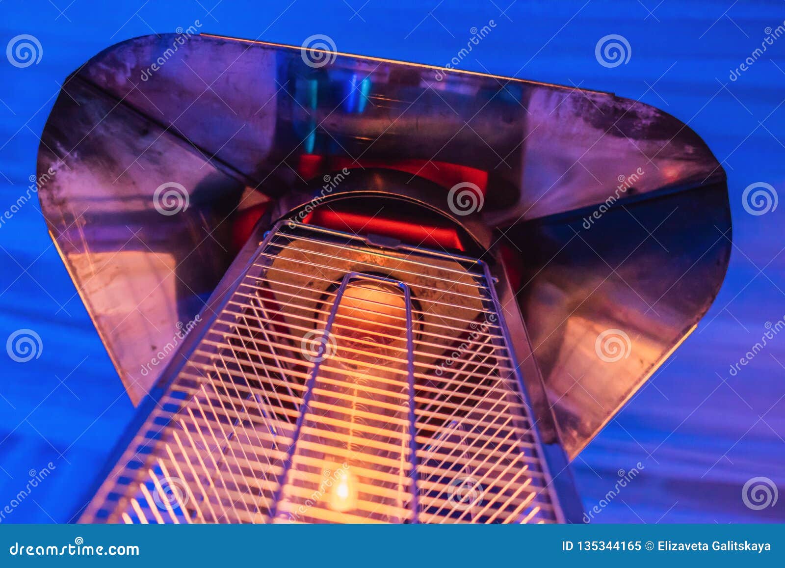 Heating Lamp Heater Placed among the Tables of an Open Cafe Stock Image