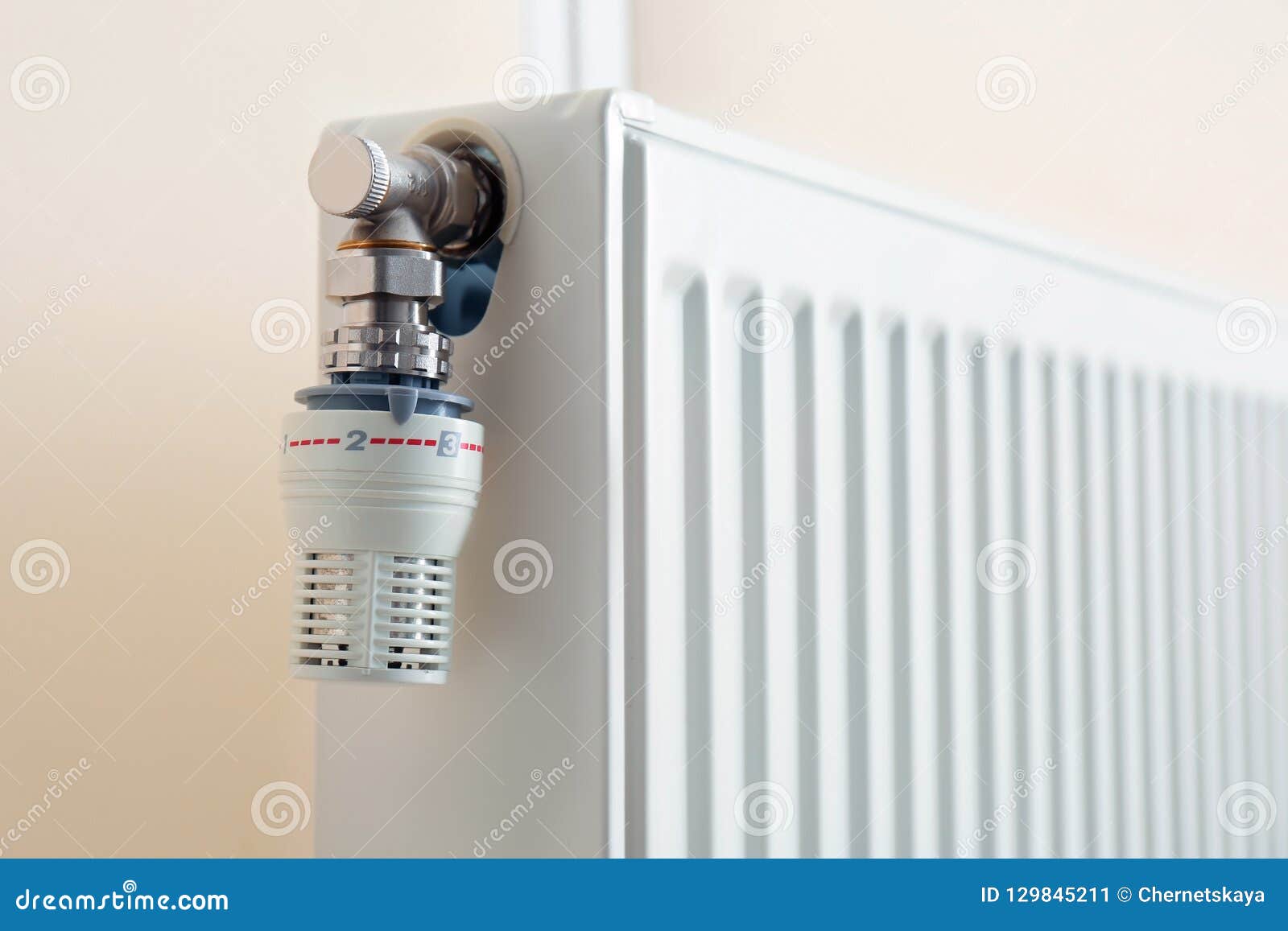 Heating Radiator with Thermostat Near Light Wall Stock Image Image of