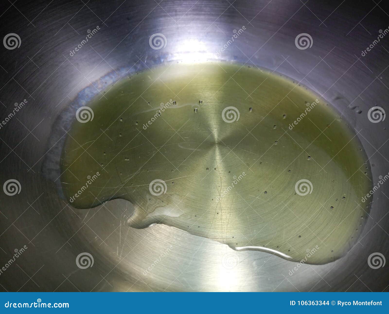 Thick olive oil in a pan stock photo. Image of heating 106363344