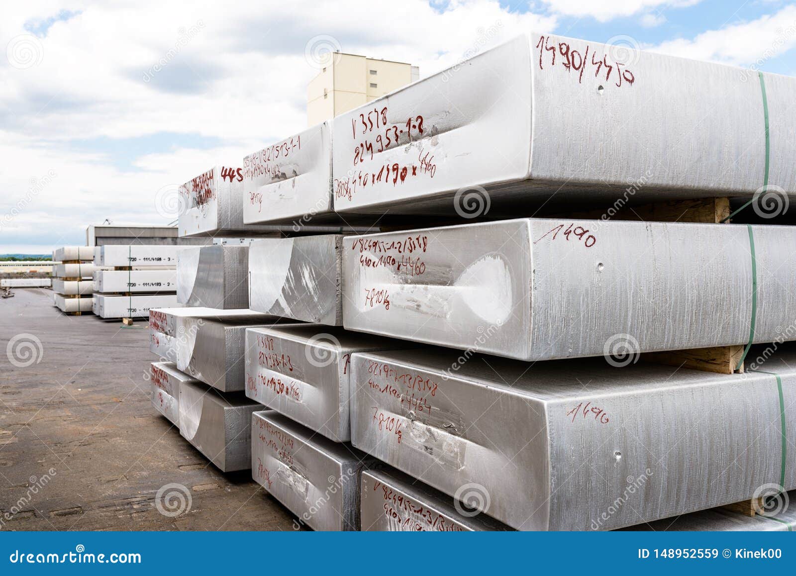 Heavy Aluminum Bars Lying on Each Other on Stack in the Square of an