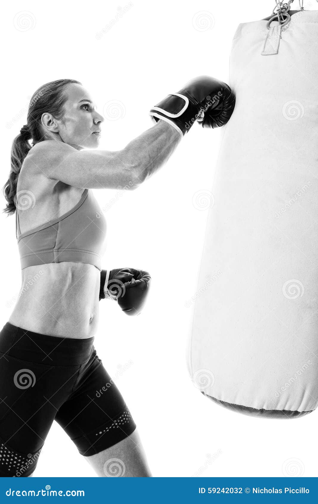 Heavy Bag Exercise stock photo. Image of studio, woman 59242032