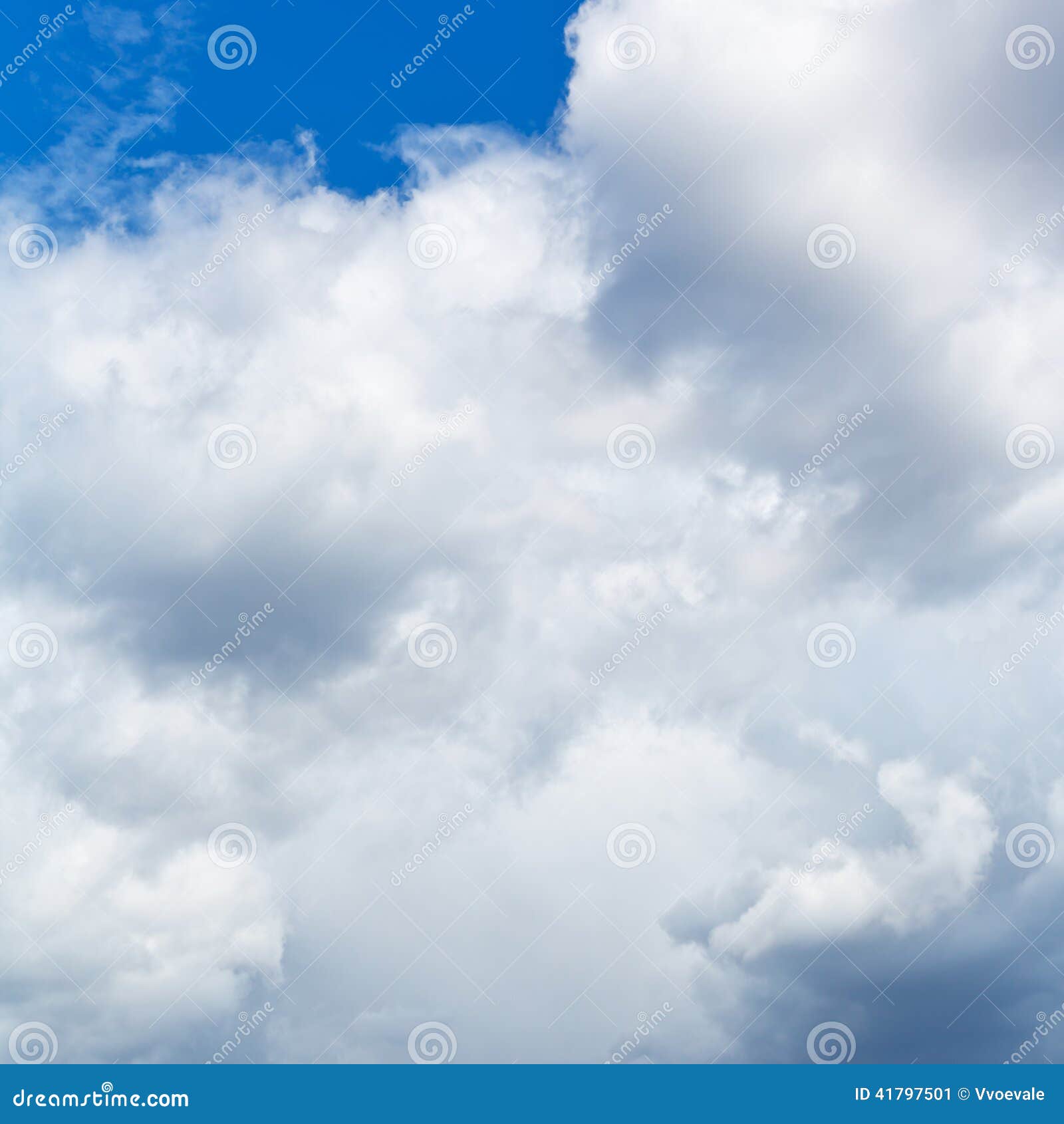 heavy cumuli clouds in blue sky