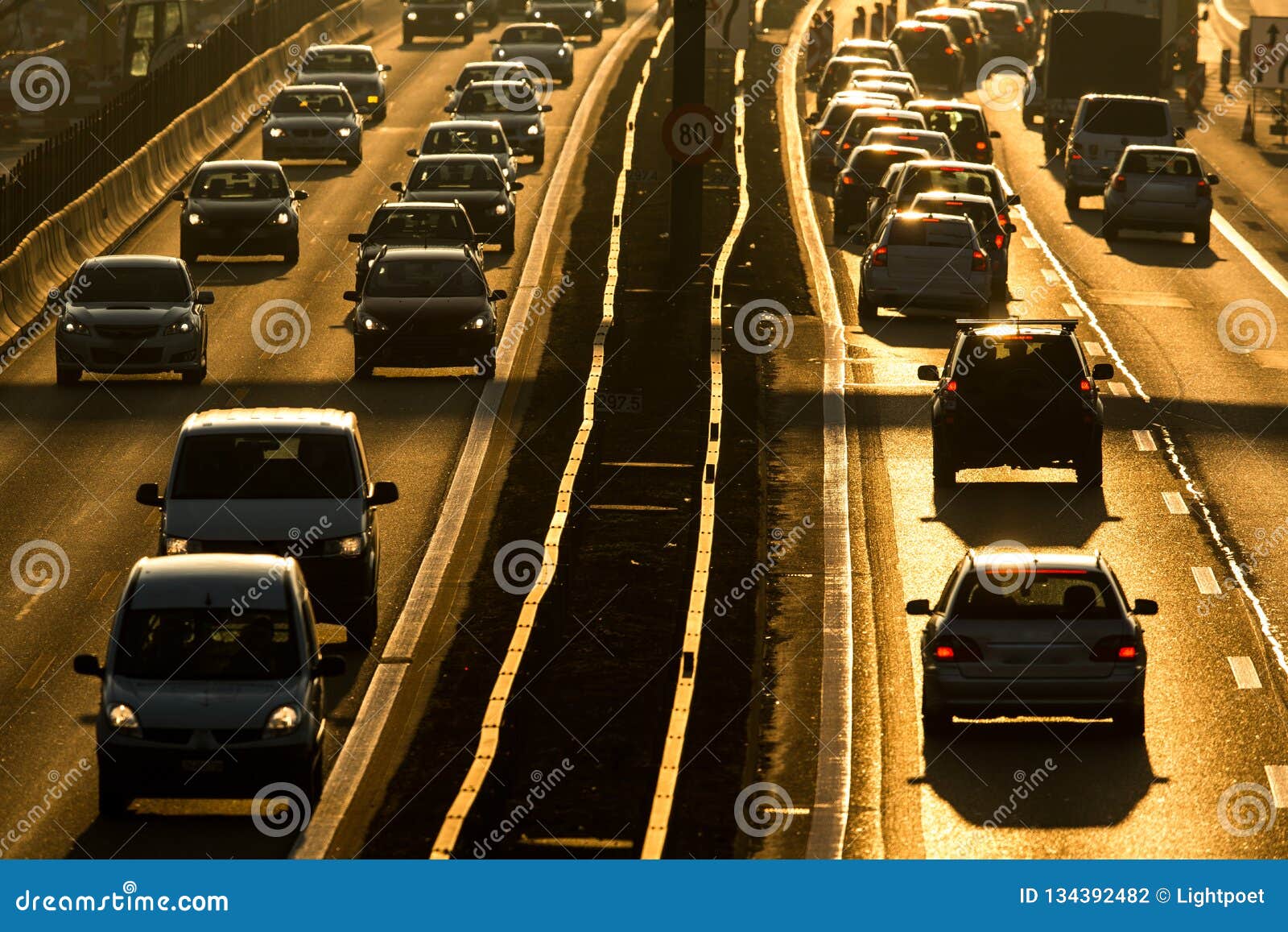 cars going very slowly in a traffic jam during the morning rushhour