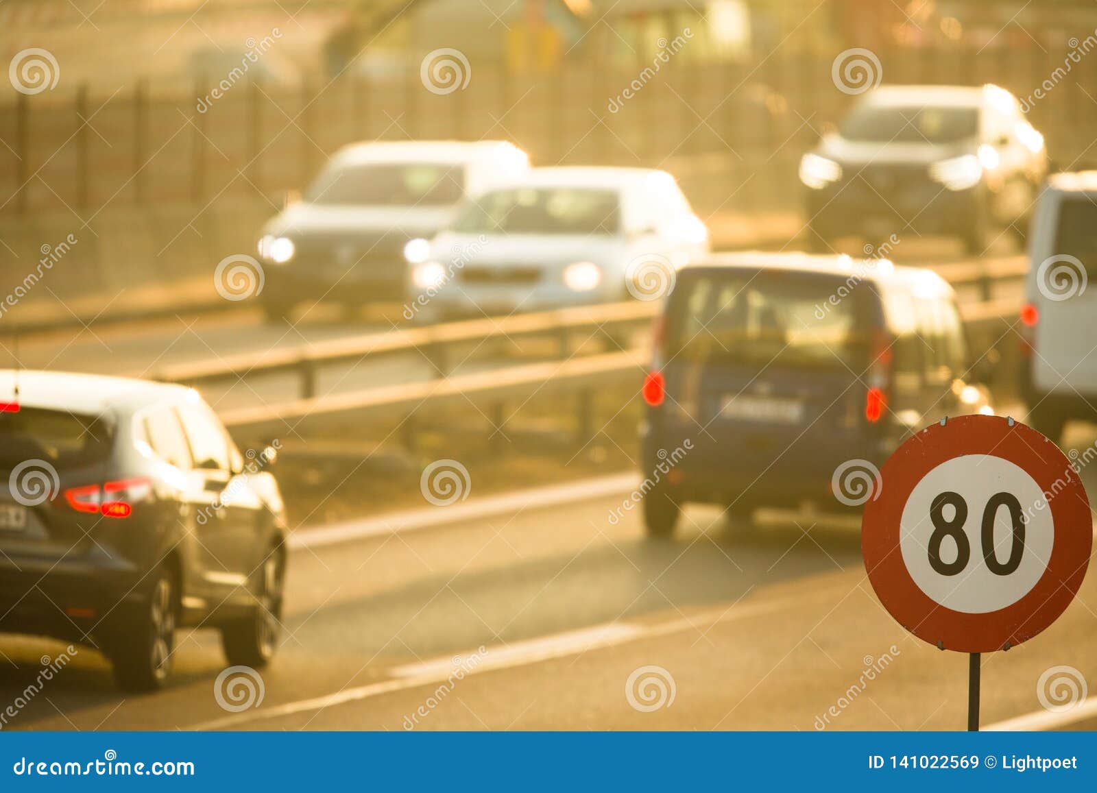 cars going very slowly in a traffic jam during the morning rushhour