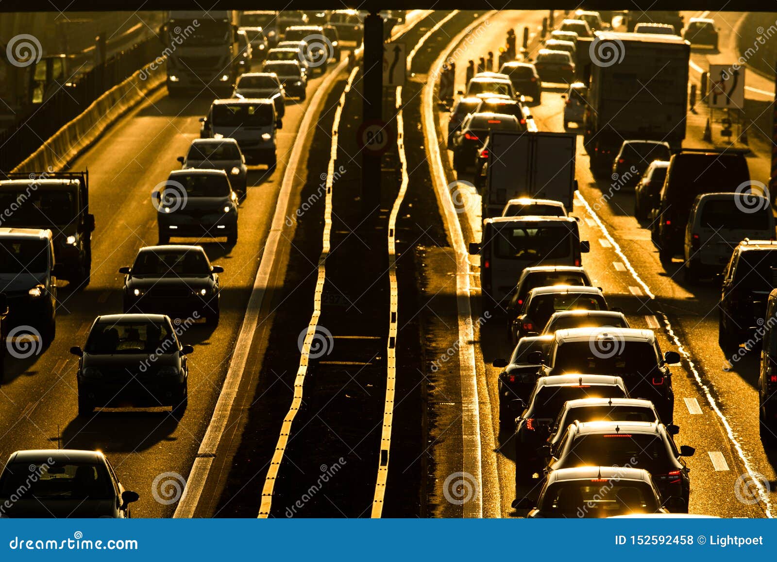 cars going very slowly in a traffic jam during the morning rushhour