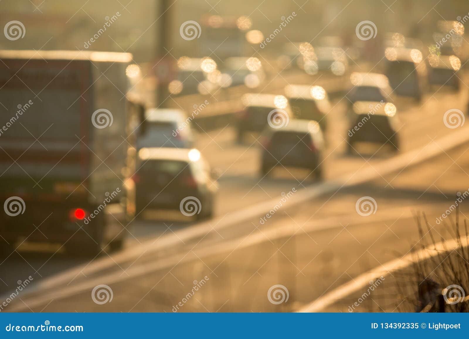 cars going very slowly in a traffic jam during the morning rushhour