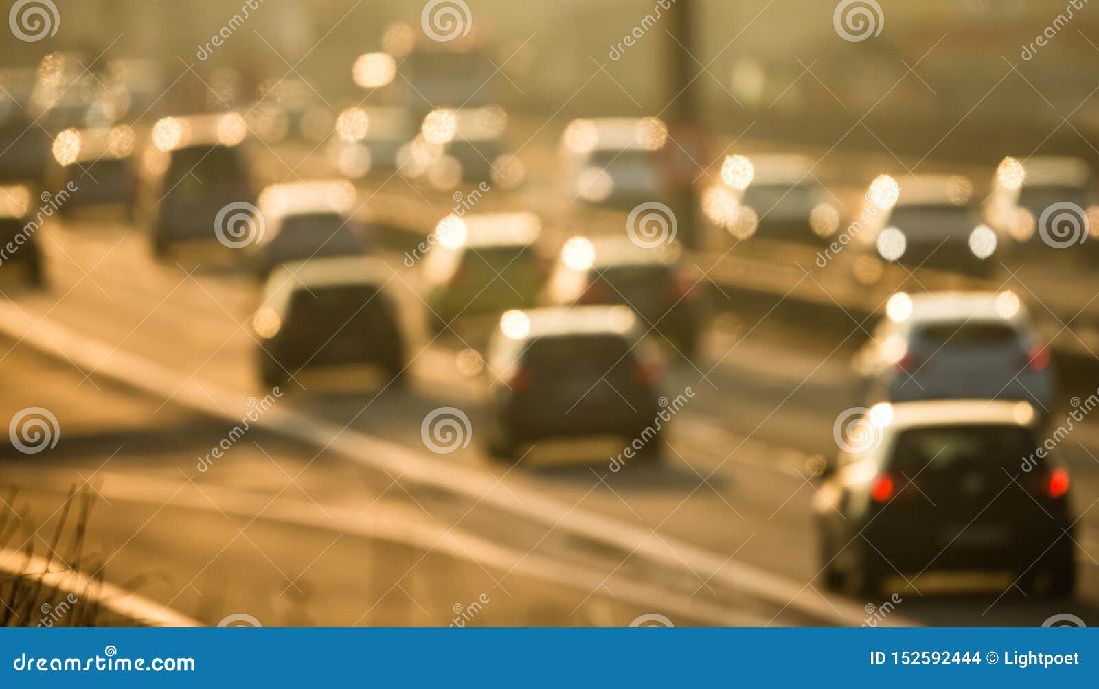 cars going very slowly in a traffic jam during the morning rushhour