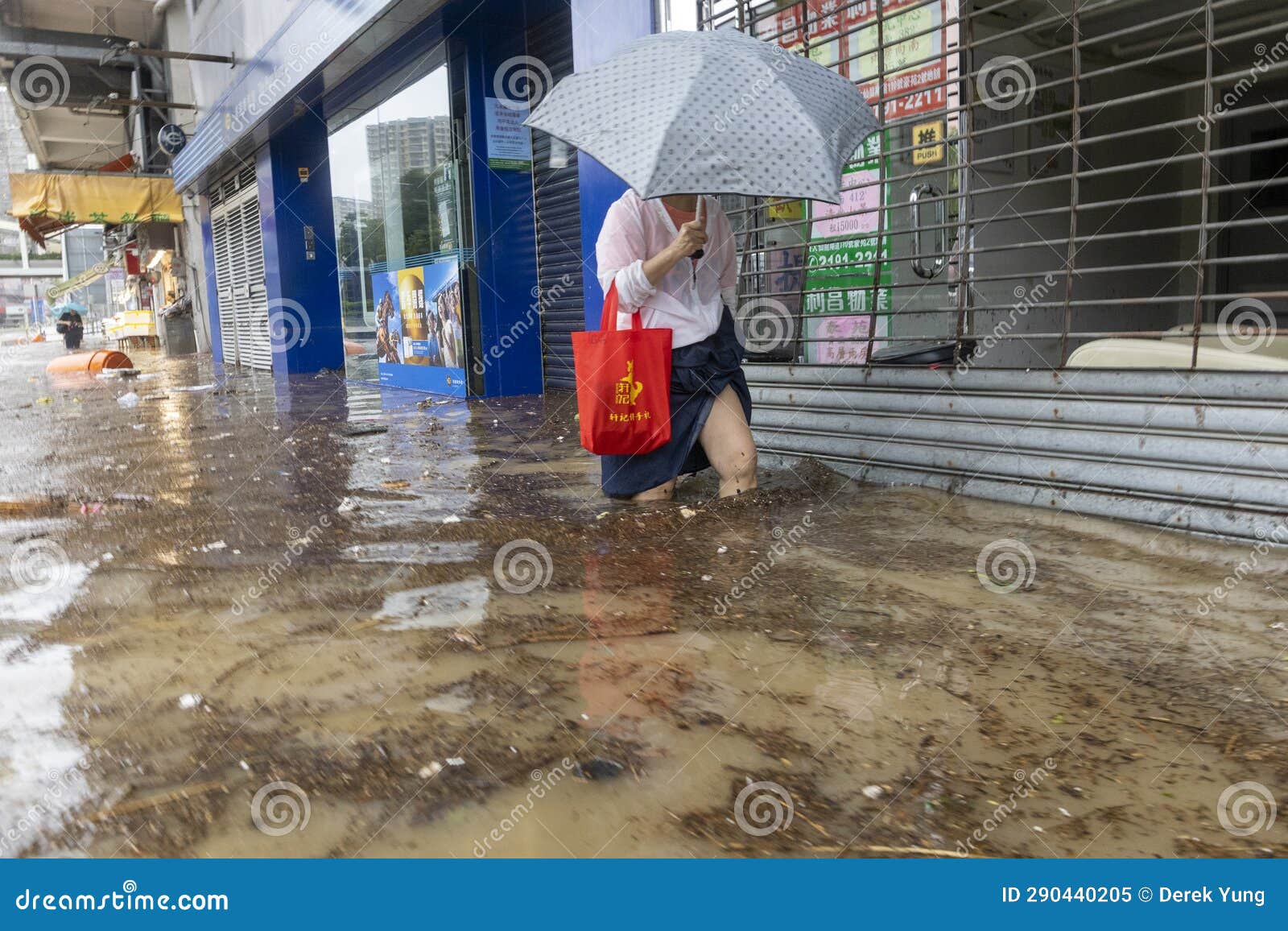 After Heavy Rain in Hong Kong, Citizens Walk in Muddy Water on the ...