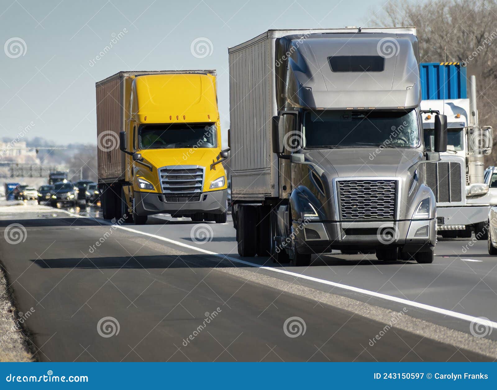 heavy semi trucks convoy on the interstate