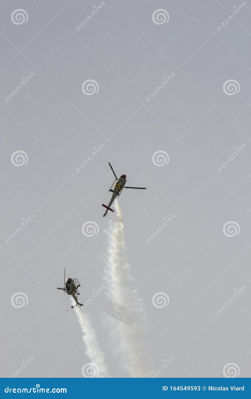 helicopter eurocopter colibri from the patrulla aspa patrol flying during the spanish airshow festival aereo internacional aga 75,