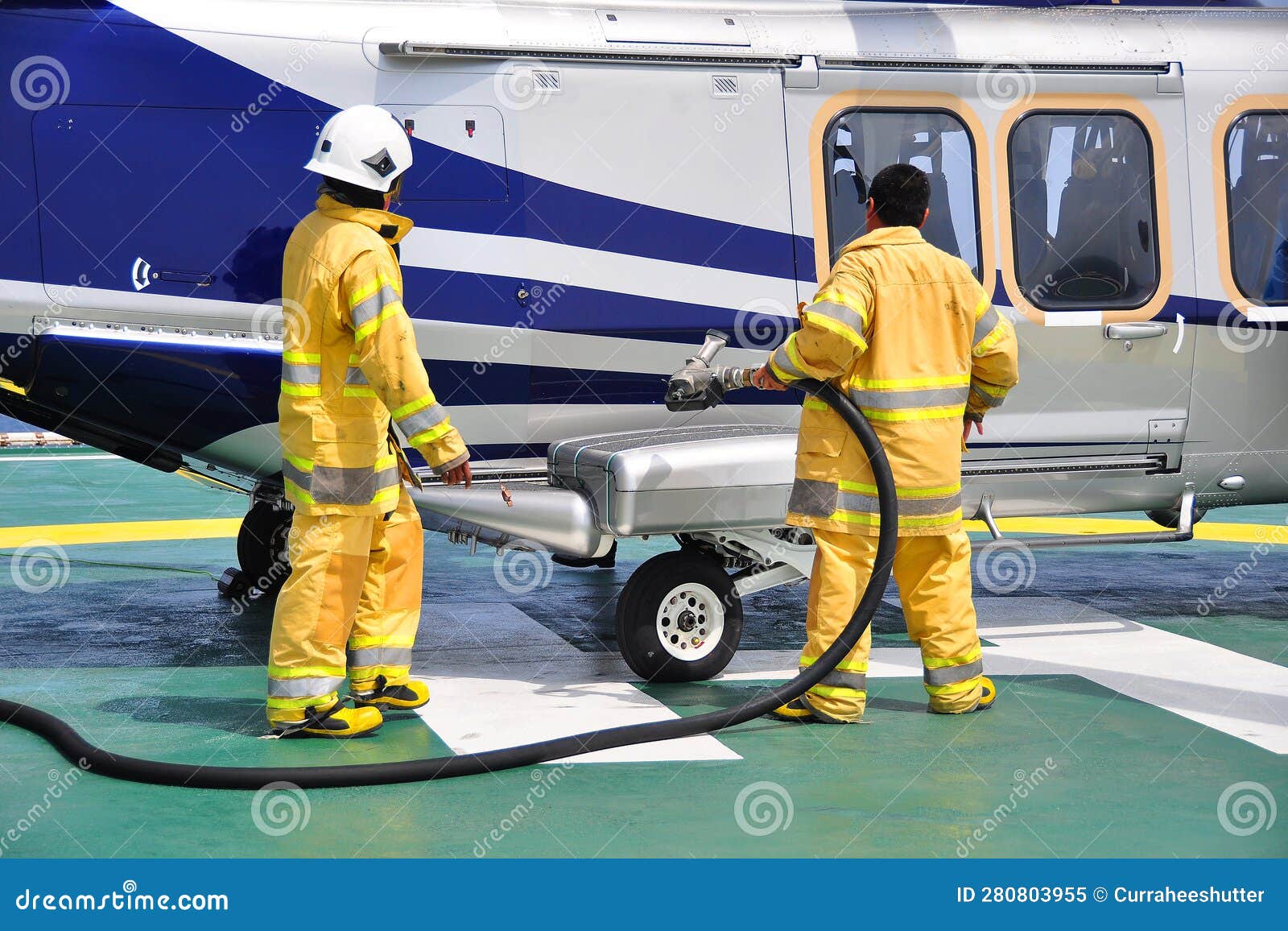 Helicopter Landing Officer Communicating with Pilot and Copilot for