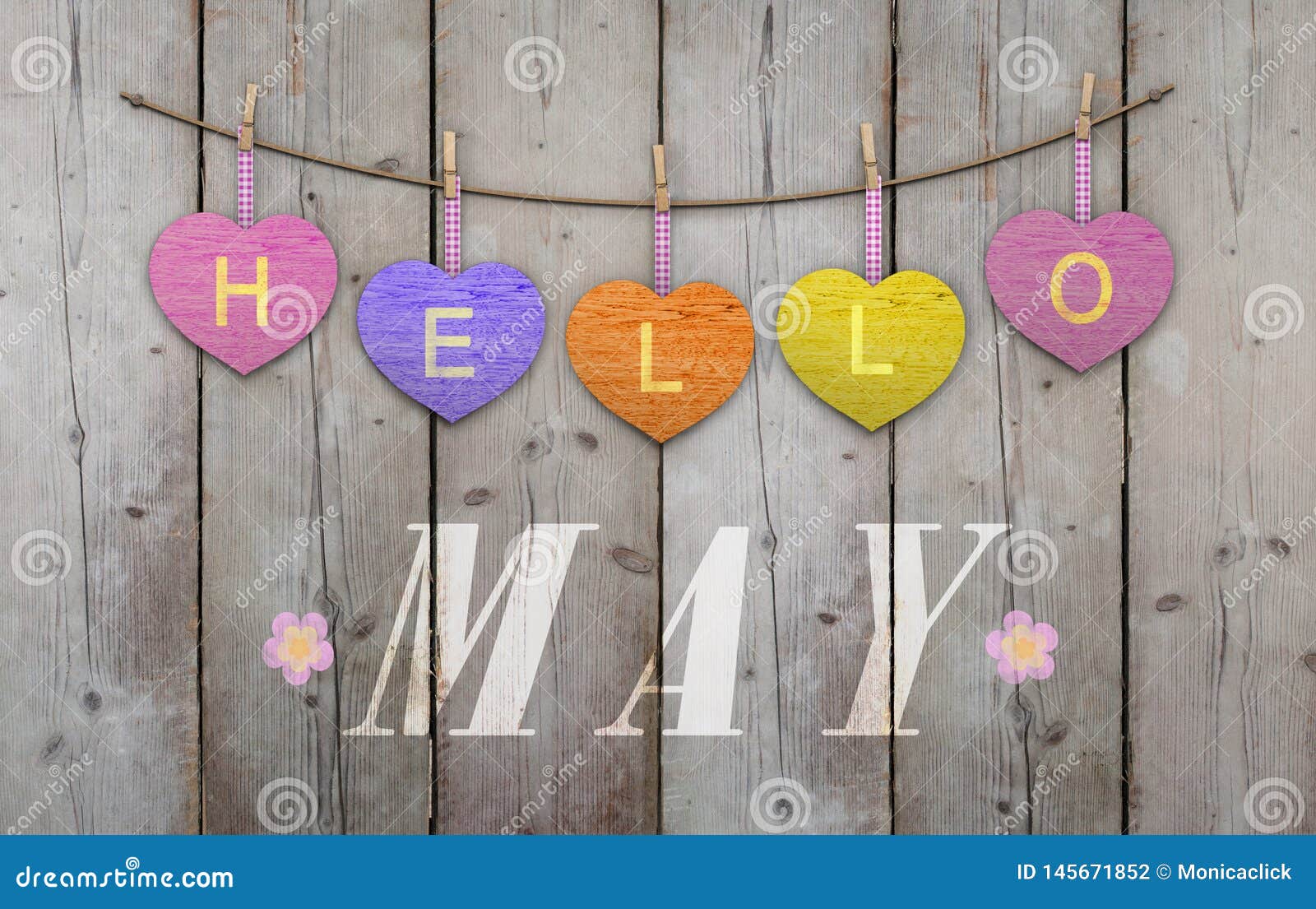 hello may written on hanging pink and orange and purple hearts and weathered wooden background