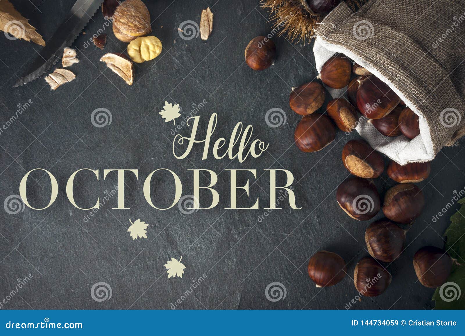 hello october card. roasted chestnuts on a rock table