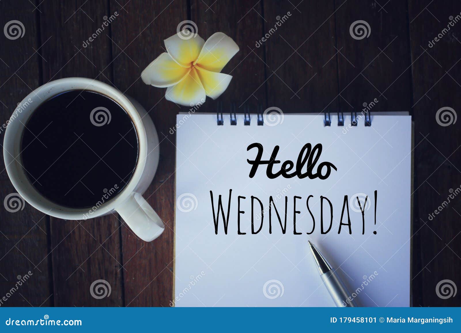 hello wednesday. have a happy, beautiful and productive wednesday concept. with morning coffee and text greeting on notepad.