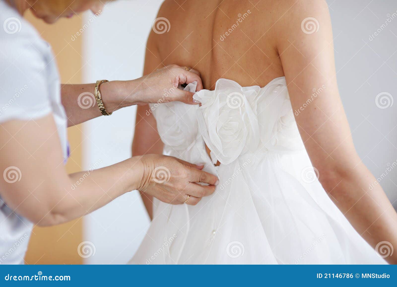 Helping the Bride To Put Her Wedding Dress Stock Photo Image of