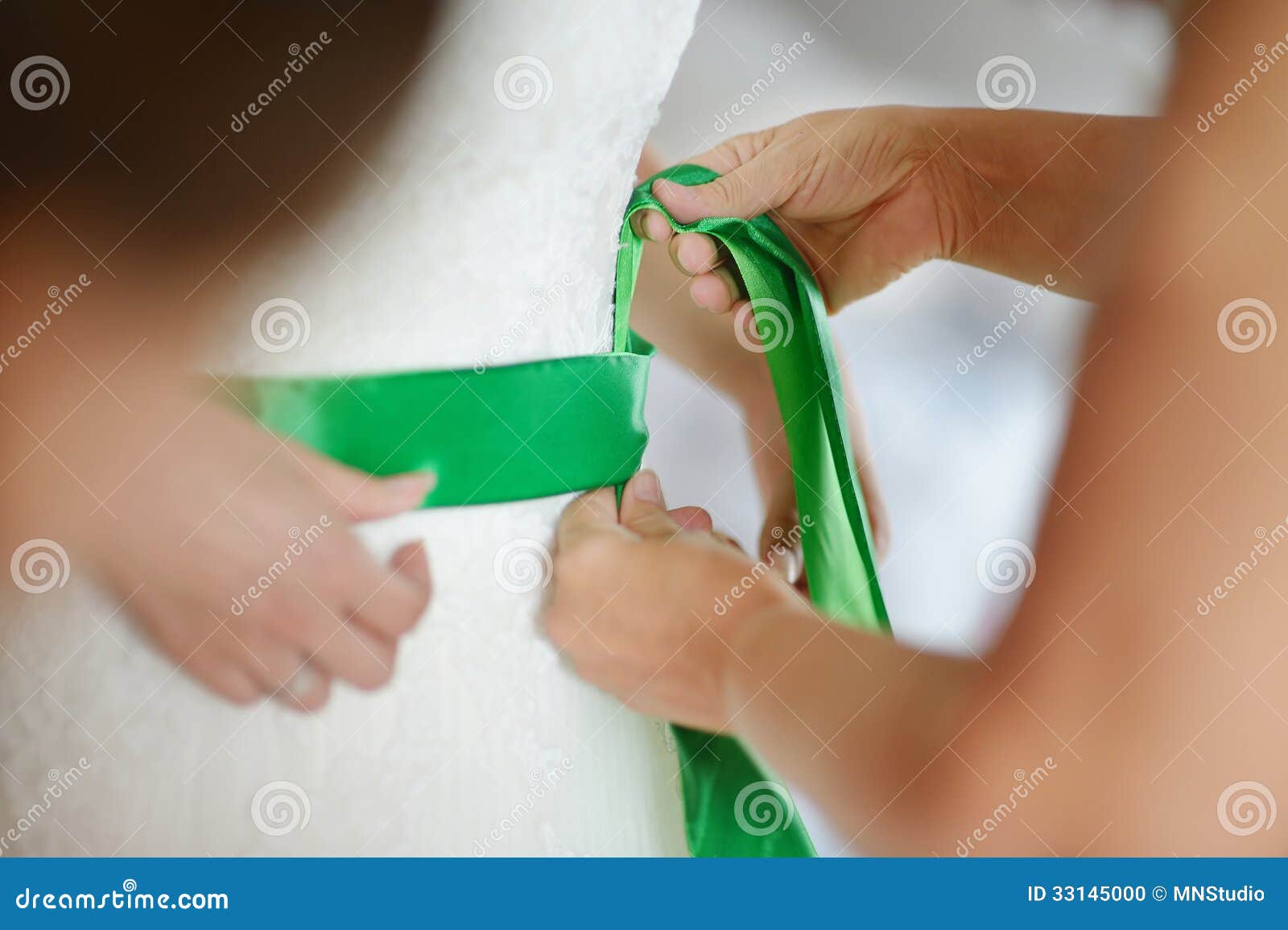 Helping the Bride To Put Her Wedding Dress Stock Photo Image of bride