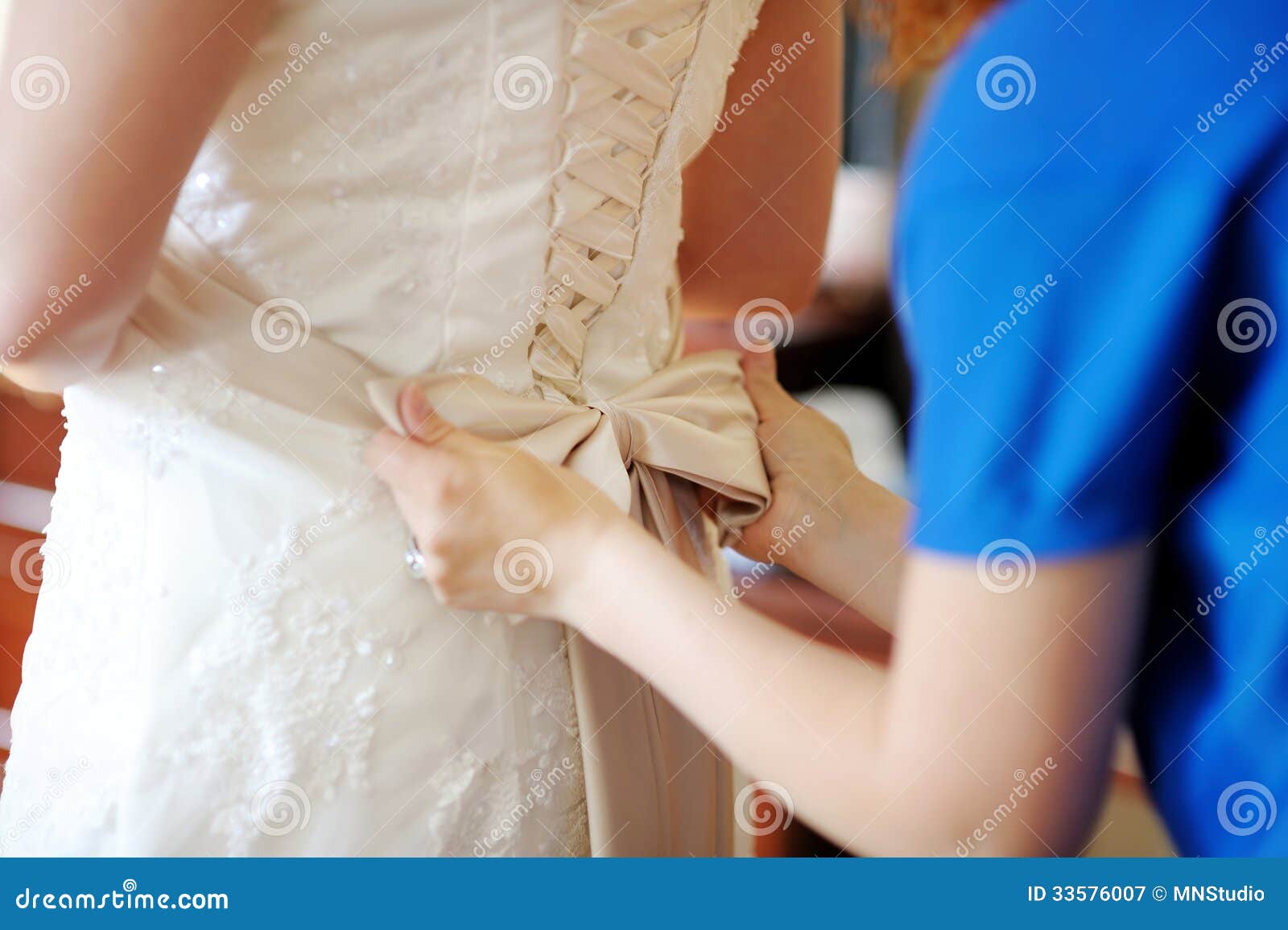 Helping the Bride To Put Her Wedding Dress Stock Image Image of hand, dress 33576007