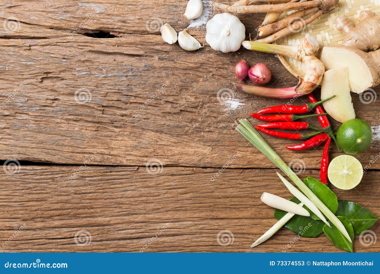 herb ingredient of tom yum spicy soup traditional thai food cuisine on wood texture background