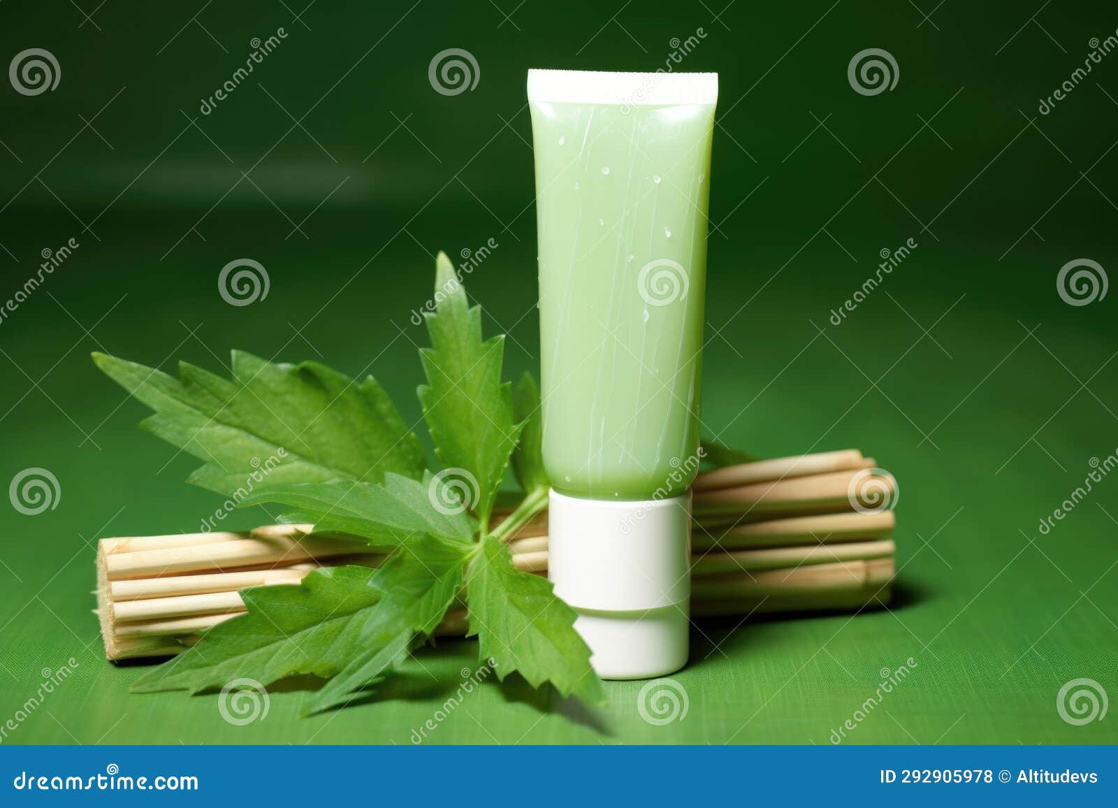 Herbal Toothpaste Tube Against a Green Background Stock Photo Image