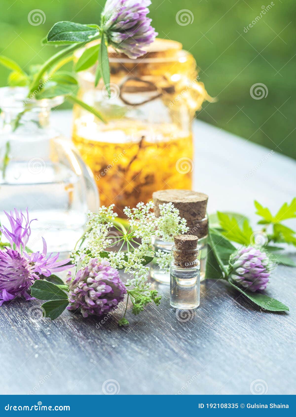 herbs, bottles on wooden background. alternative medicine, natural healing