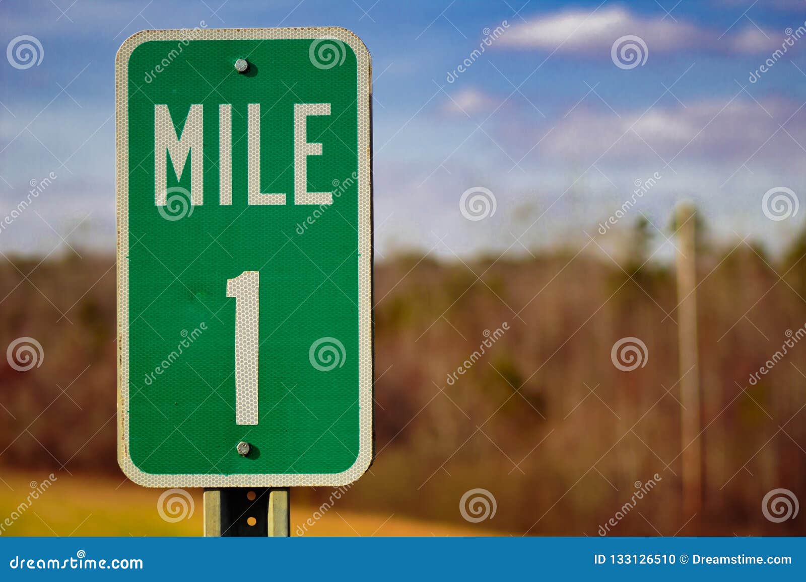 here is a 1 mile sign on the road