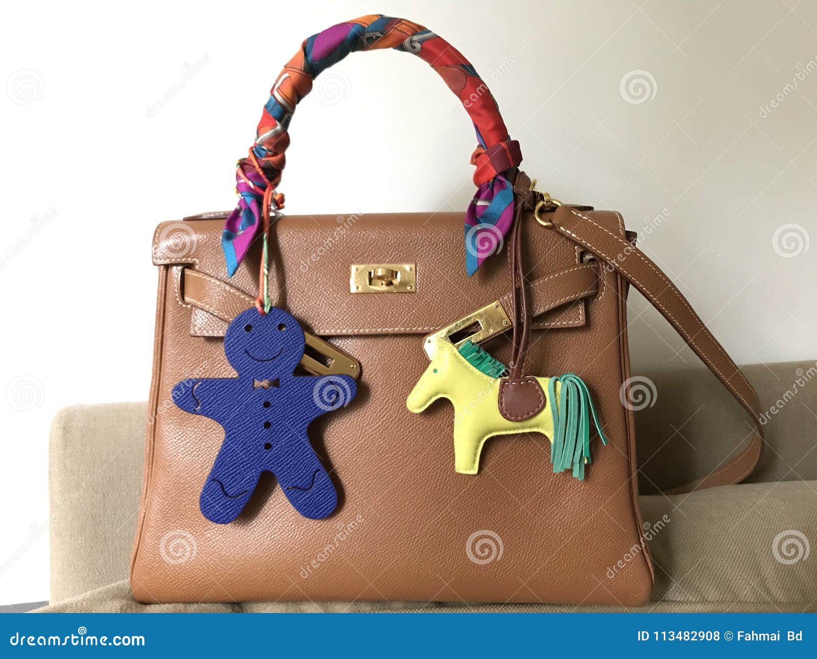 Hermes Kelly Bag Size 28 Epsom Leather in Gold Color with Silk Twilly Scarf  Petit H and Rodeo Bag Charm Stock Photo - Image of hermeslover, luxury:  113482908