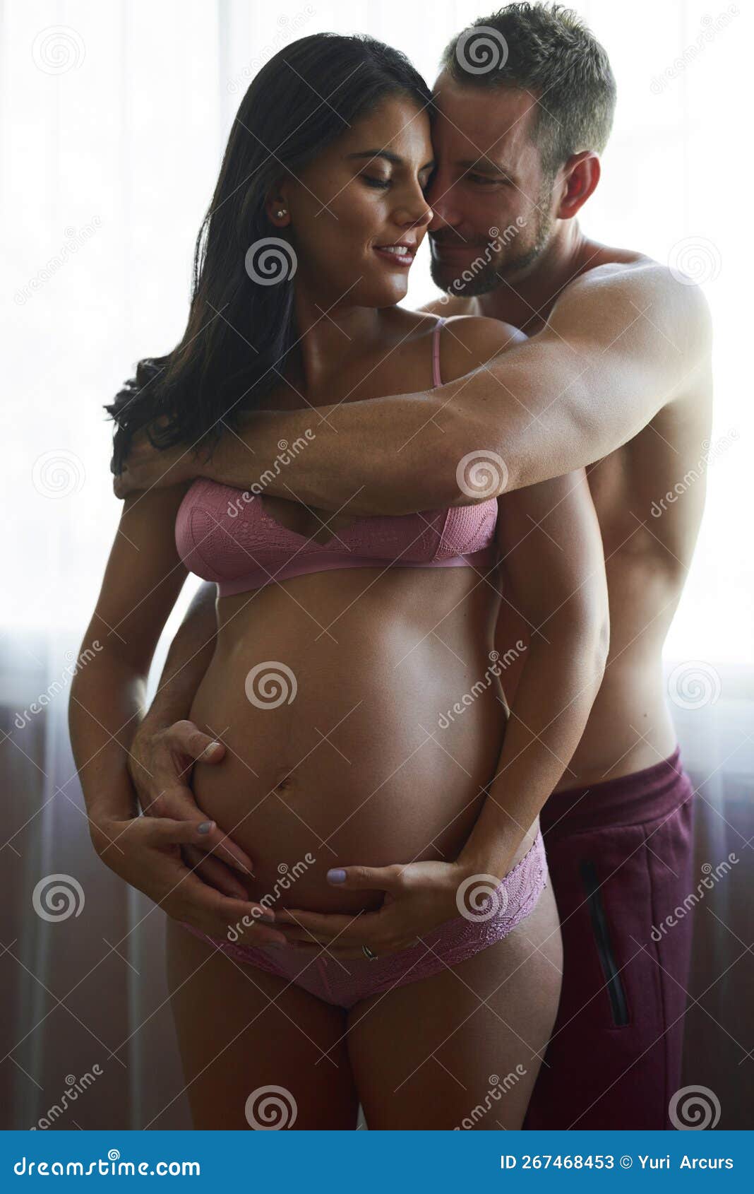 Pregnant Couple Lingerie Stock Photos photo