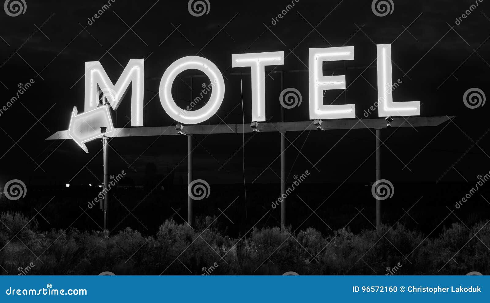 Het teken van het neonmotel. Een neonteken voor een motel in zwart-wit