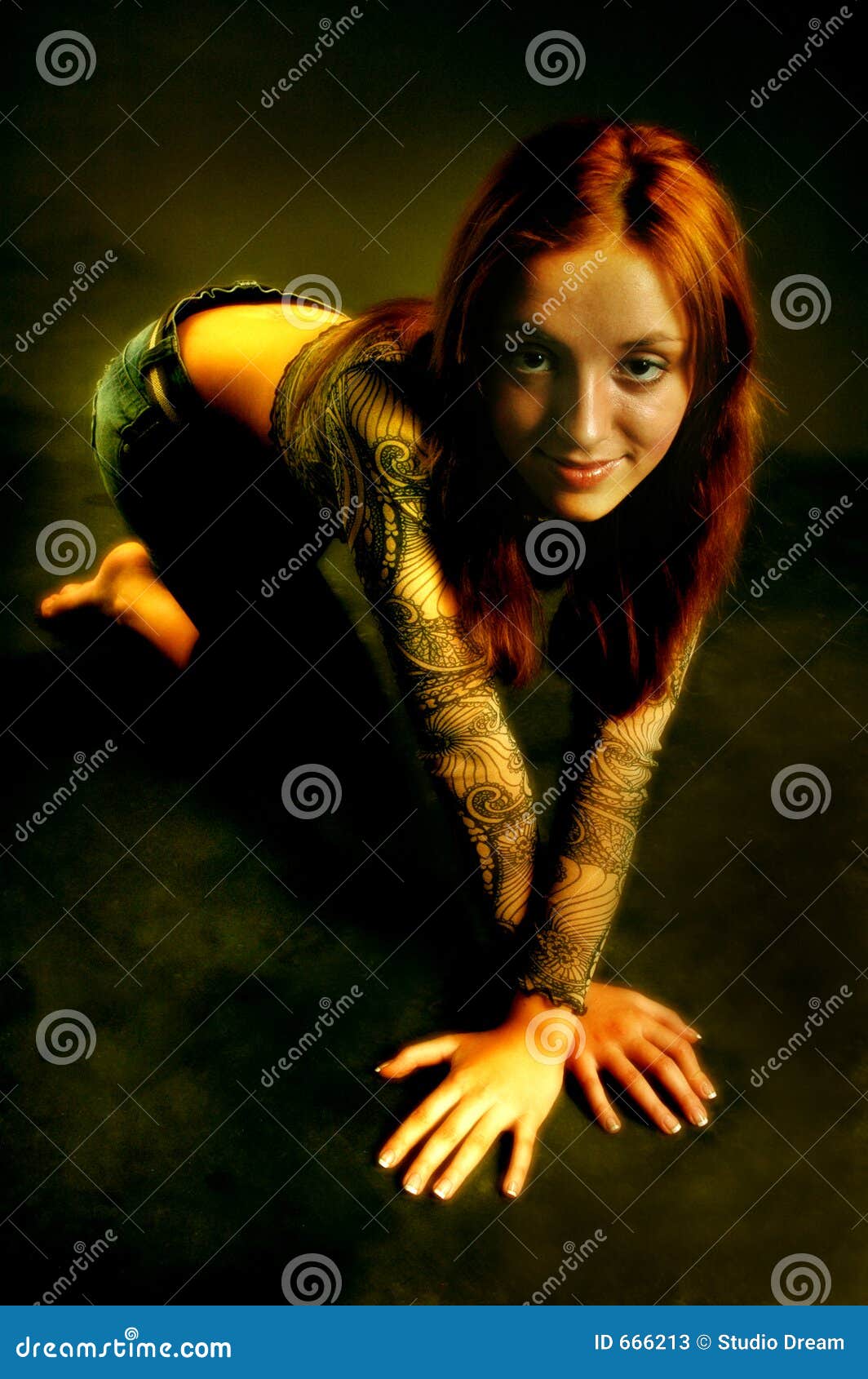Blonde fit woman in black bra and panties lying in seductive pose