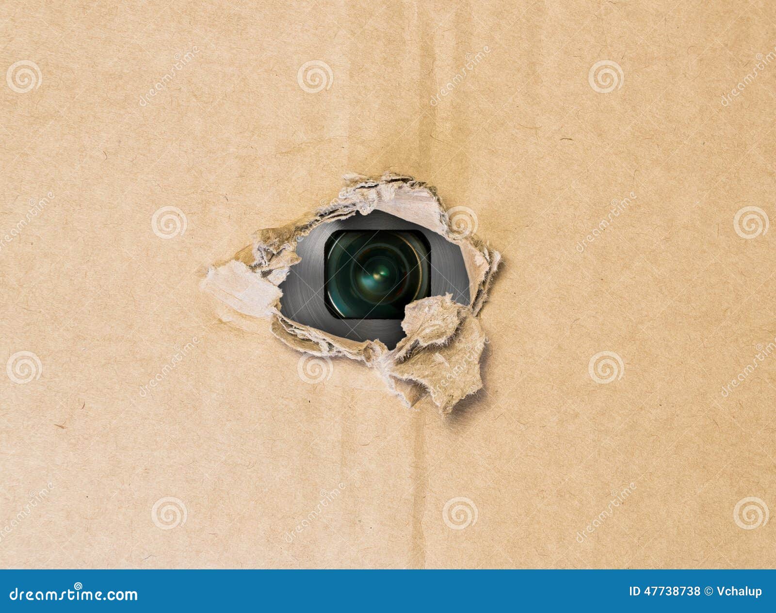 hidden camera in torn hole in cardboard paper