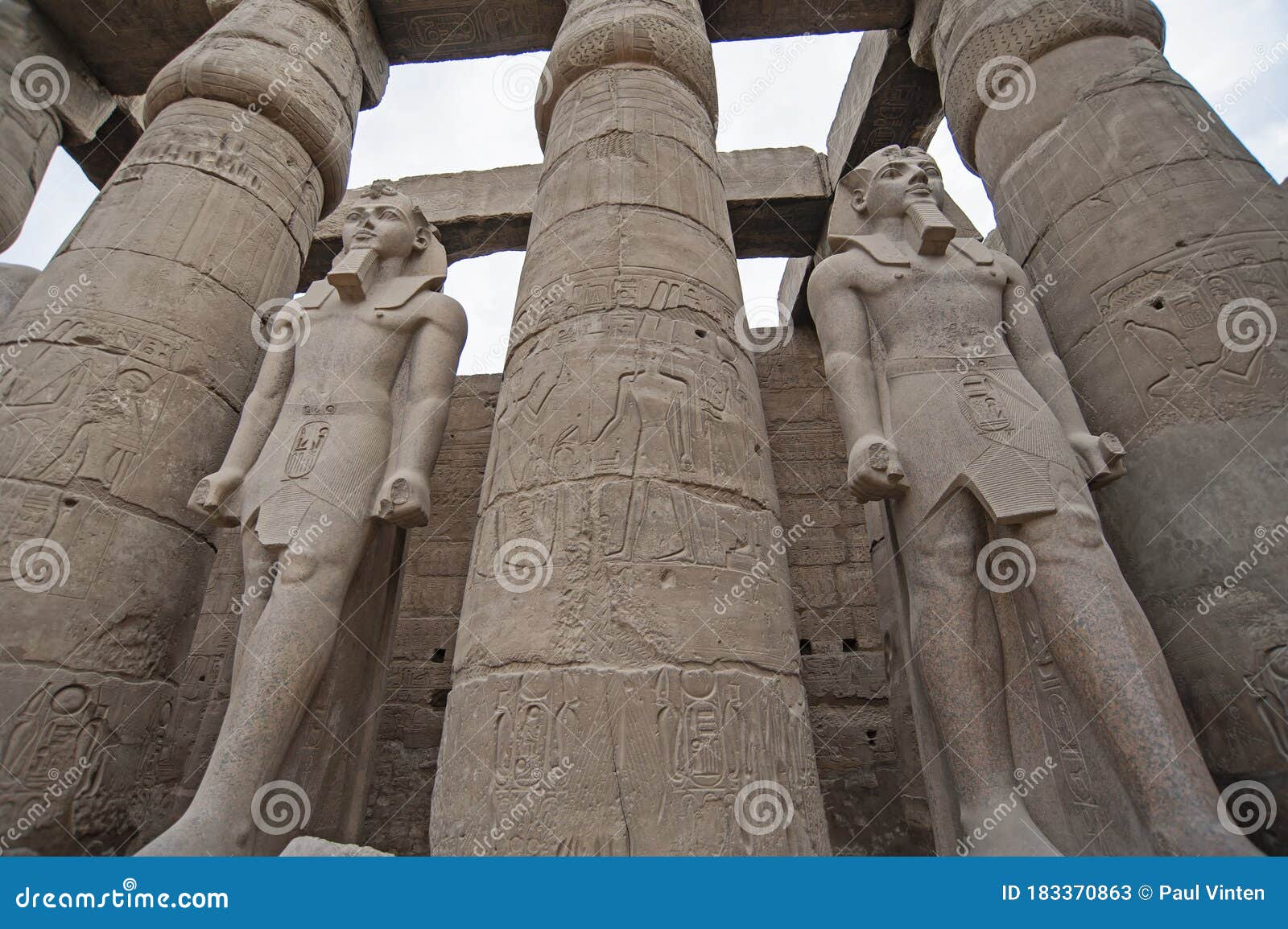 hieroglyphic carvings on ancient egyptian temple columns and statues