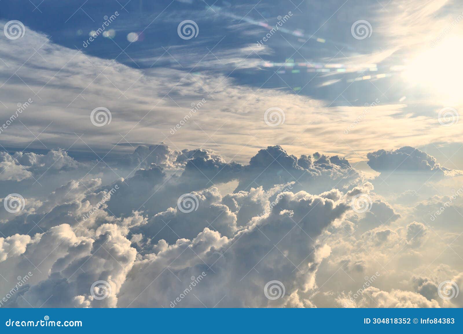 High Altitude Clouds Moving Across the Sky with the Sun Backlit Stock