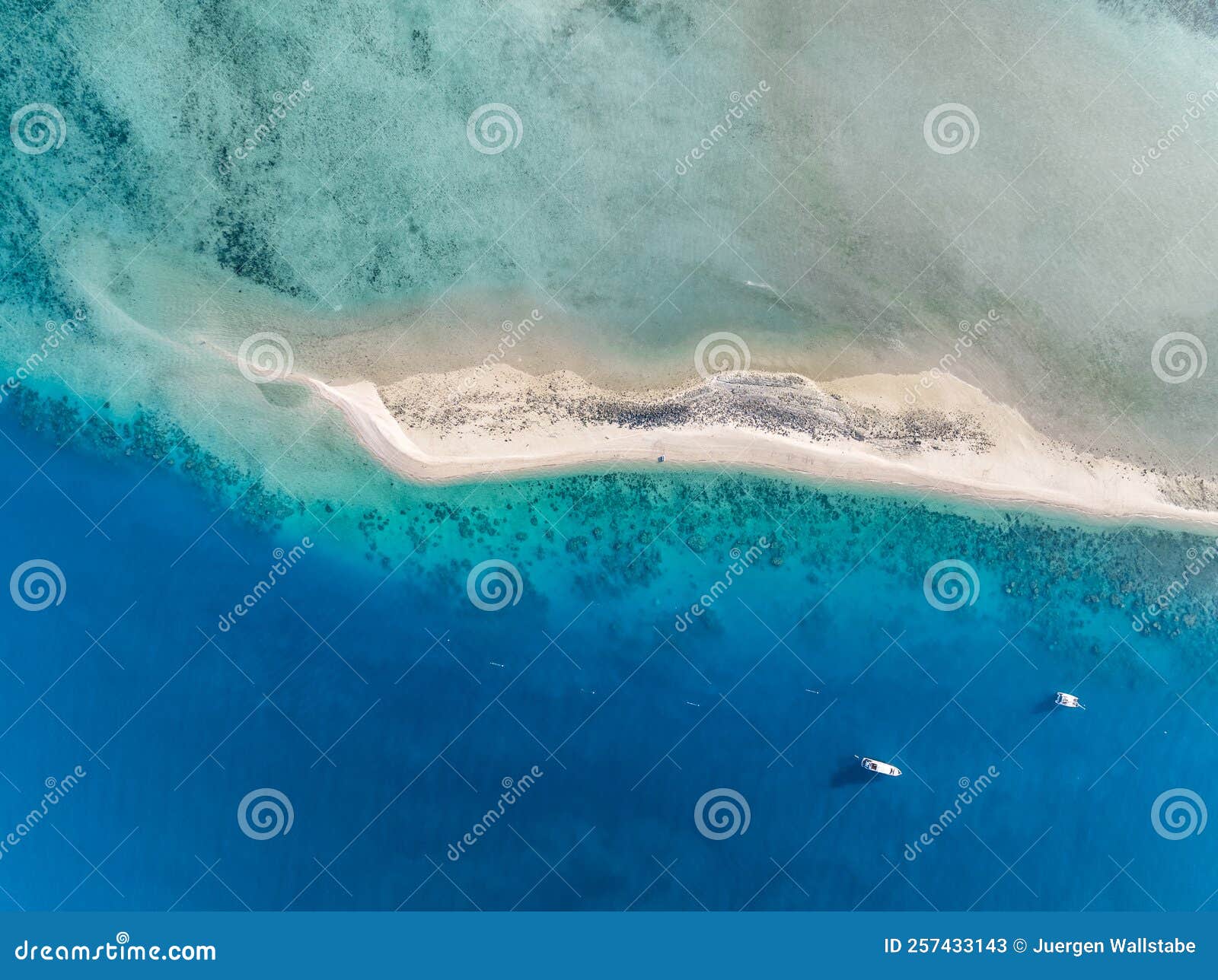 high angle aerial drone view of langford island`s sandspit or sandbar, a small islet near hayman island in the whitsunday islands