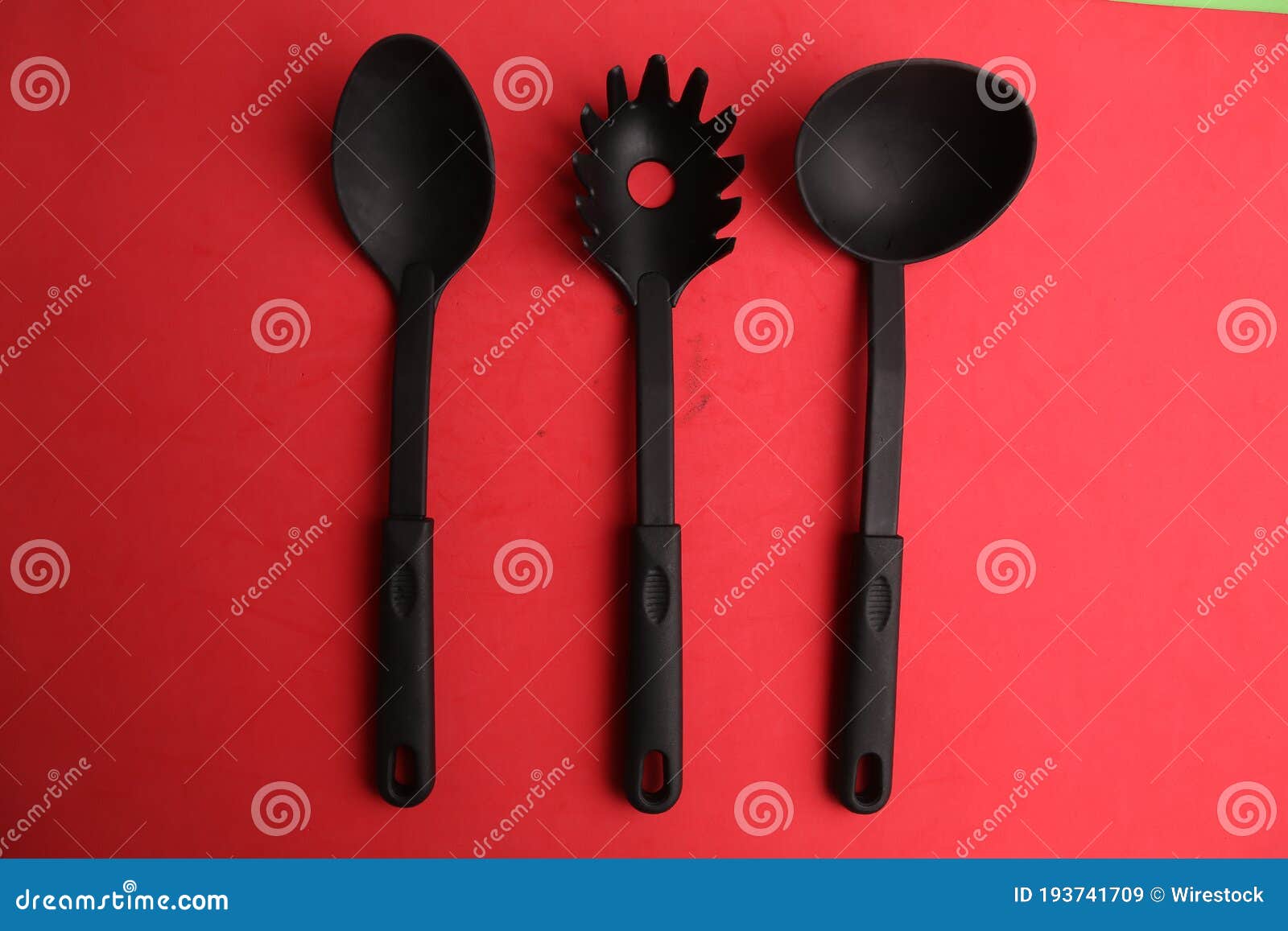 High Angle Closeup Shot of Three Different Black Plastic Ladles on a