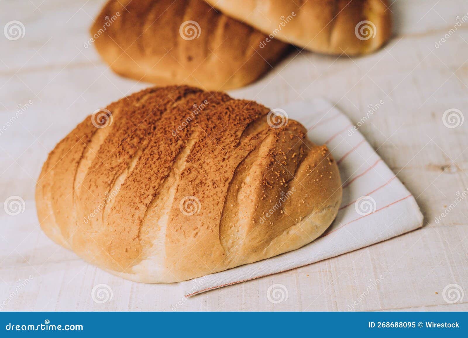 High Angle of Freshly Baked Crusty Bread Put on the White Table Surface
