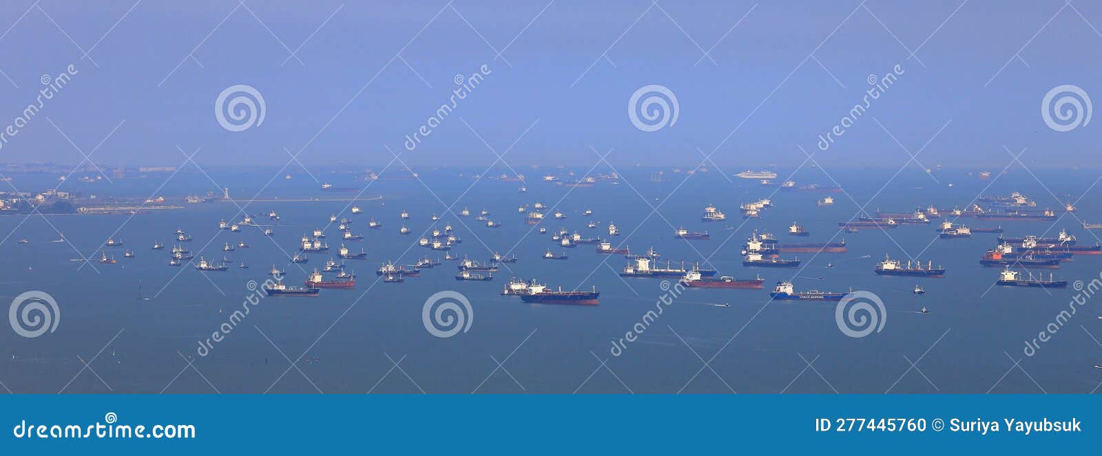 high angle panorama shot of ocean liner, tanker and cargo ship in singapore strait.