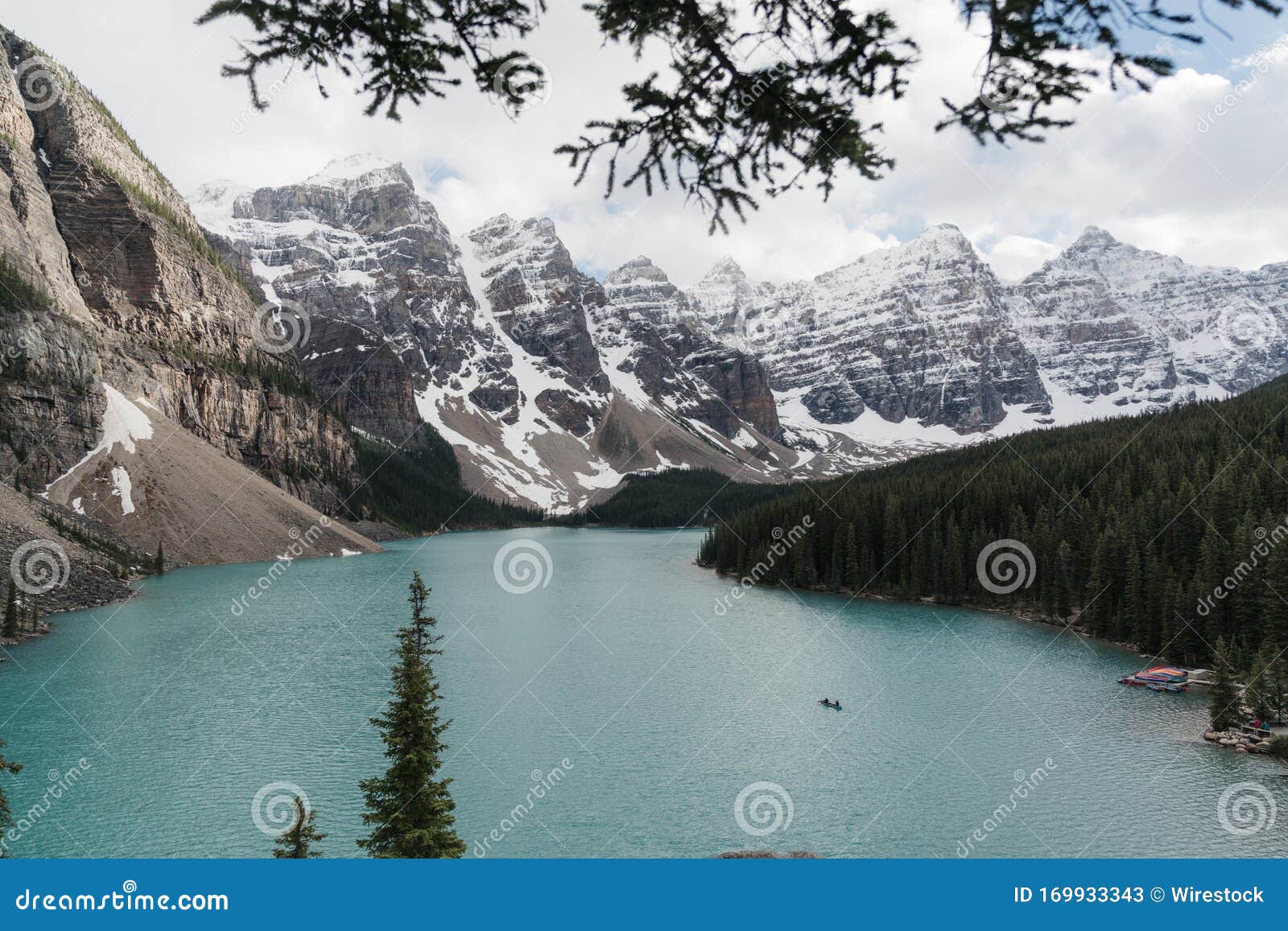 High Angle Shot Of A Clear Frozen Lake Surrounded By A Mountainous