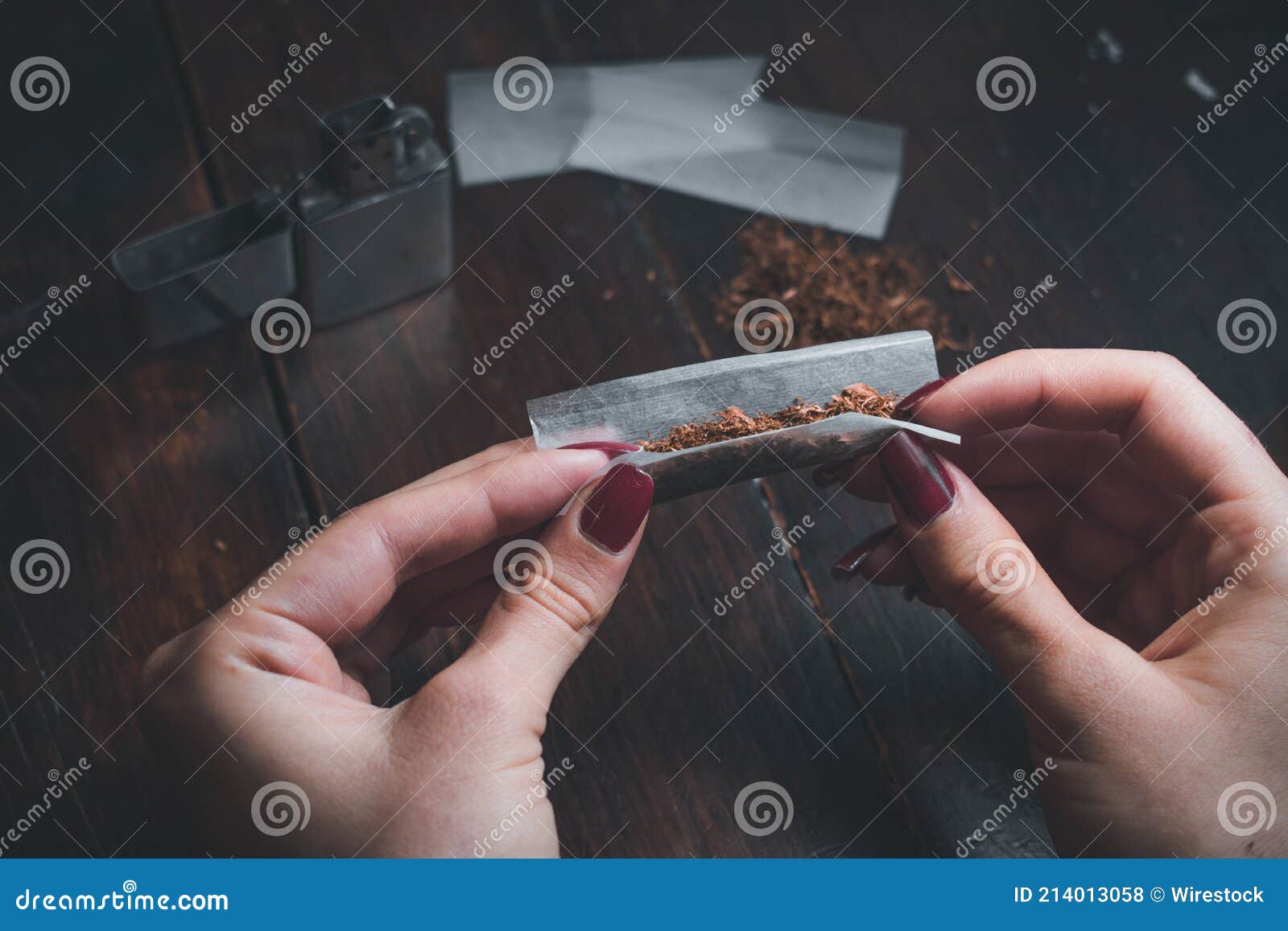 High Angle Shot of a Female Rolling a Joint Stock Photo Image of