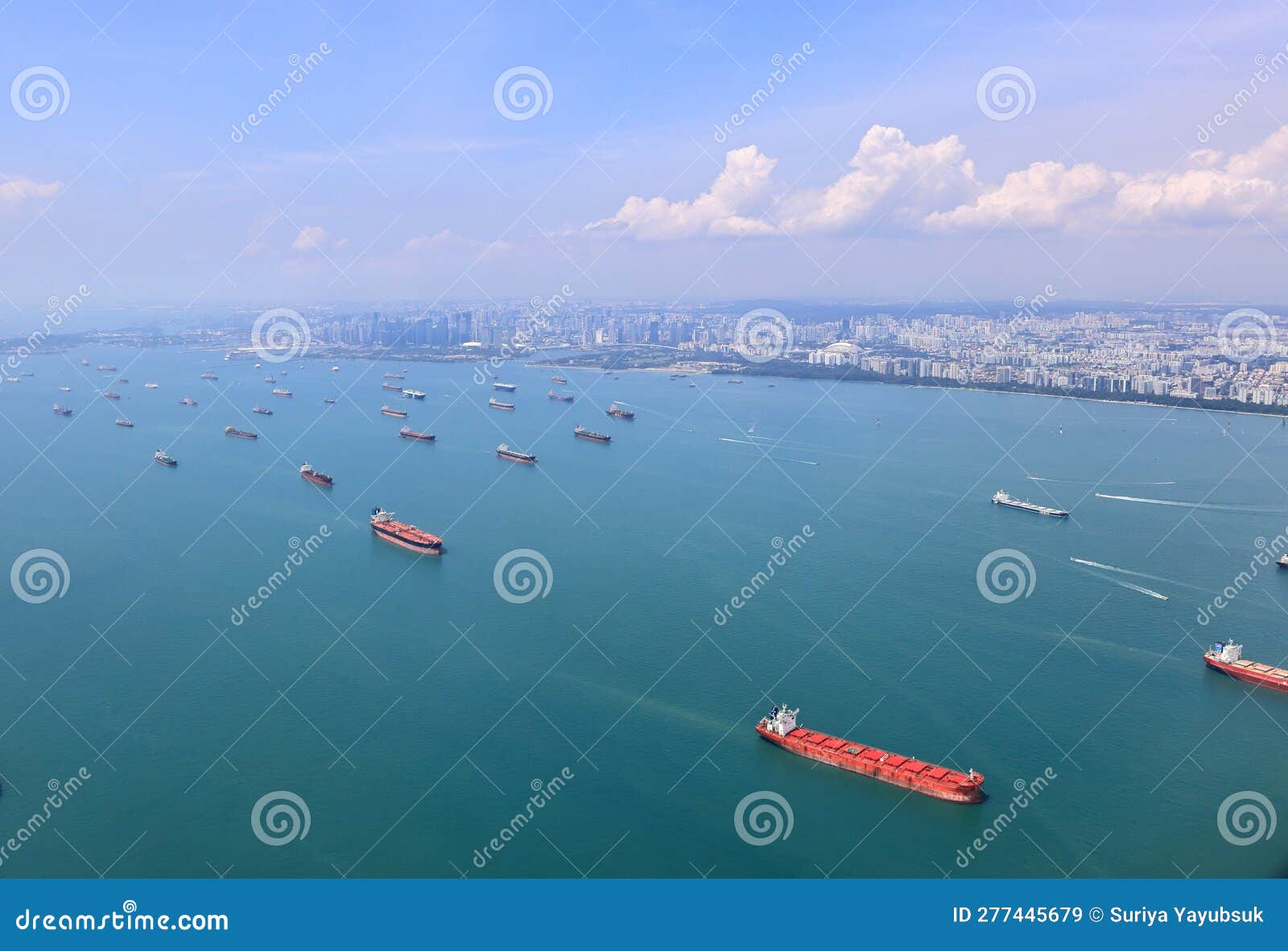 ocean liner, tanker and cargo ship in singapore strait and singapore city, see from plane.