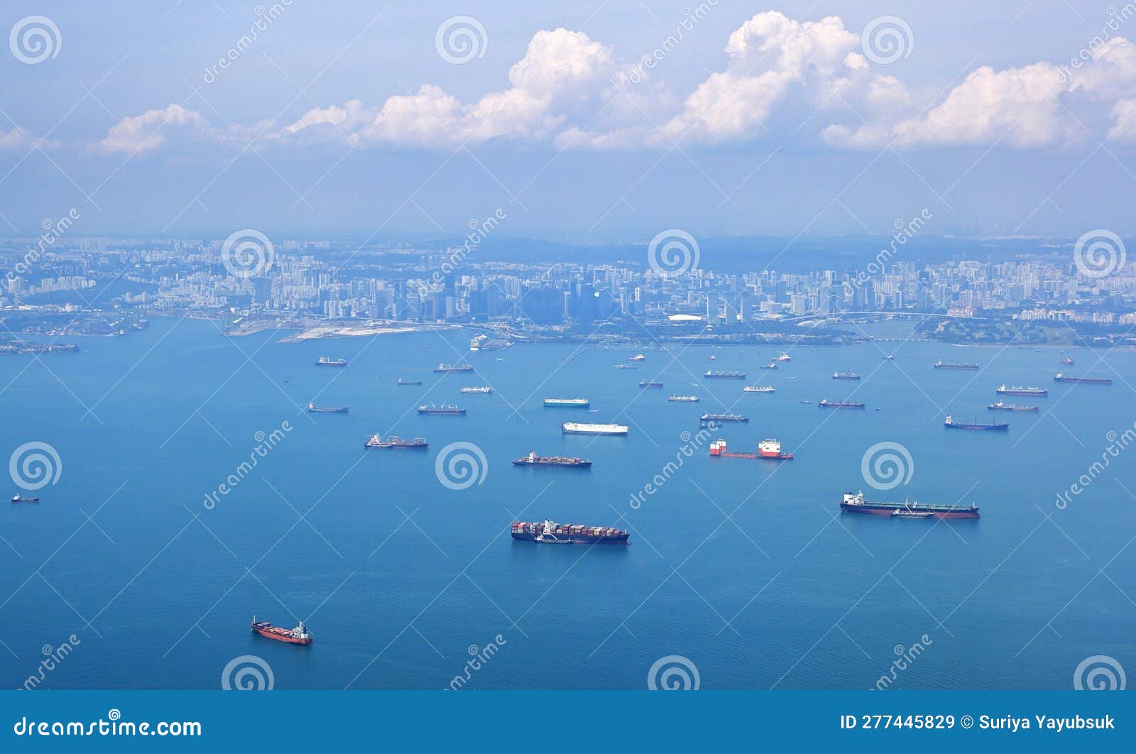 high angle shot of ocean liner, tanker and cargo ship in singapore strait.