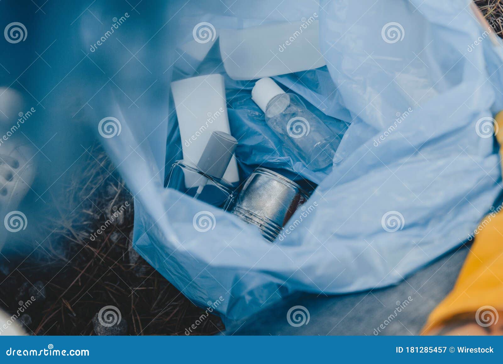 High Angle Shot of a Plastic Garbage Bag with Recyclable Bottles