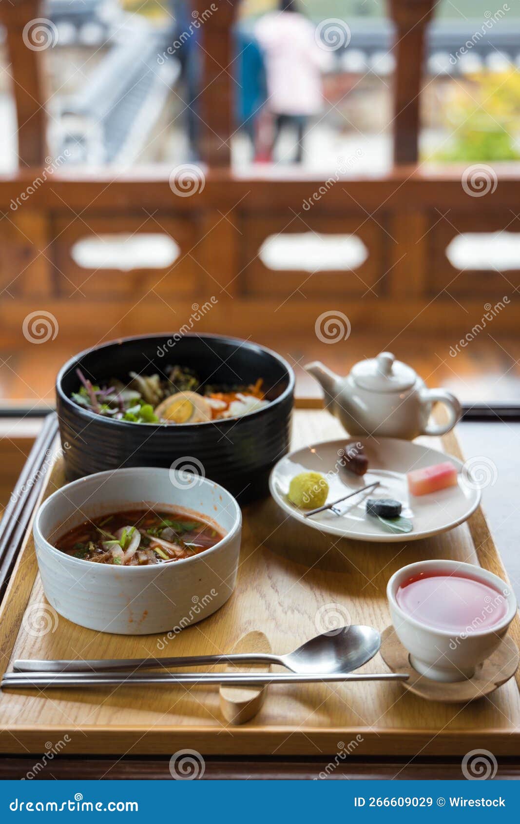 High-angle Shot of a Traditional Korean Breakfast in a Wooden Setting