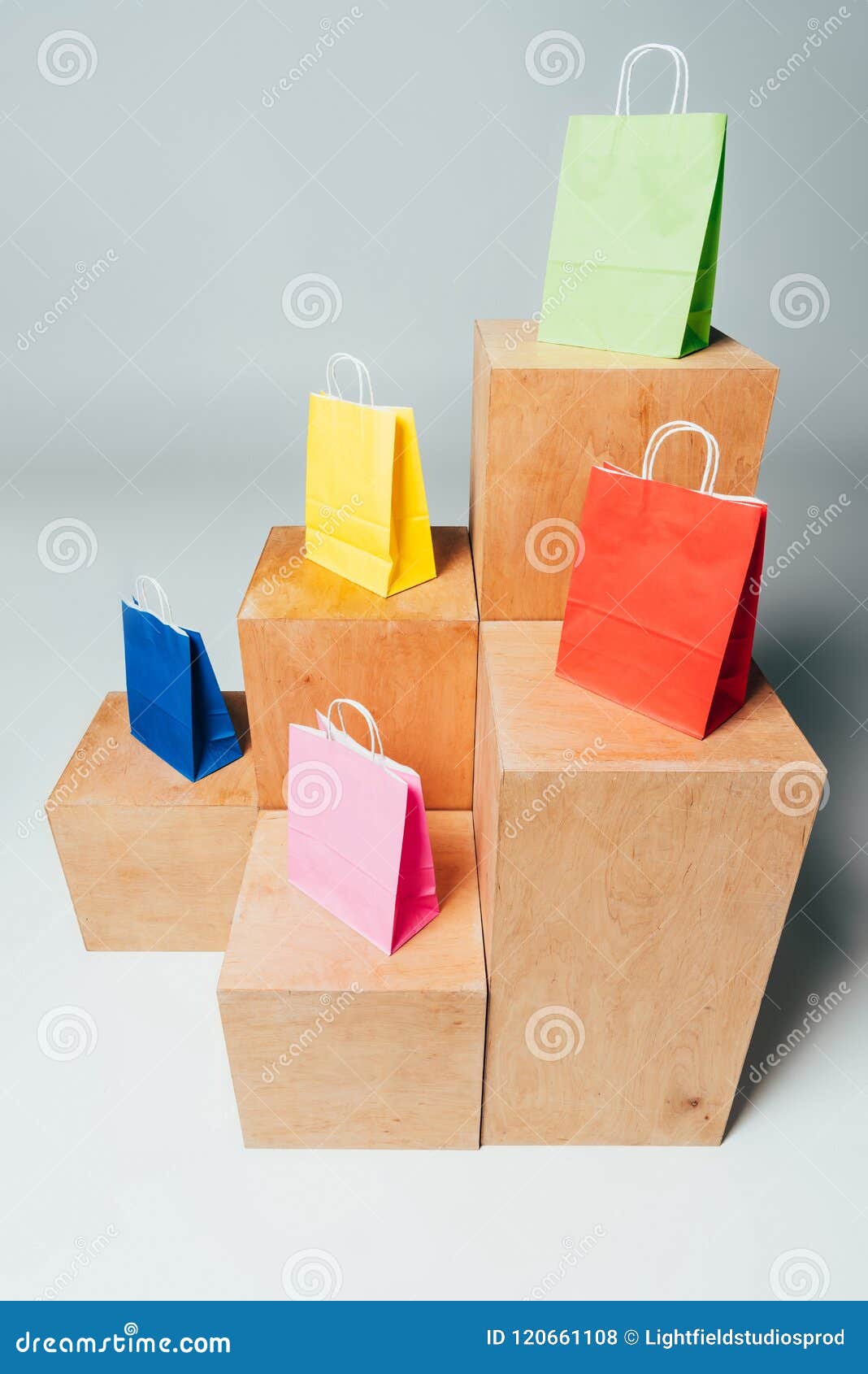 High Angle View of Colored Shopping Bags on Wooden Stands, Summer Stock ...