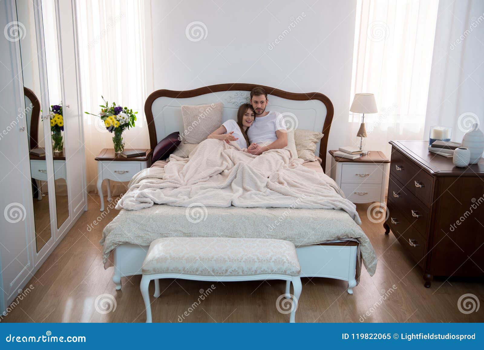 High Angle View Of Happy Couple Hugging In Cozy Stock Image