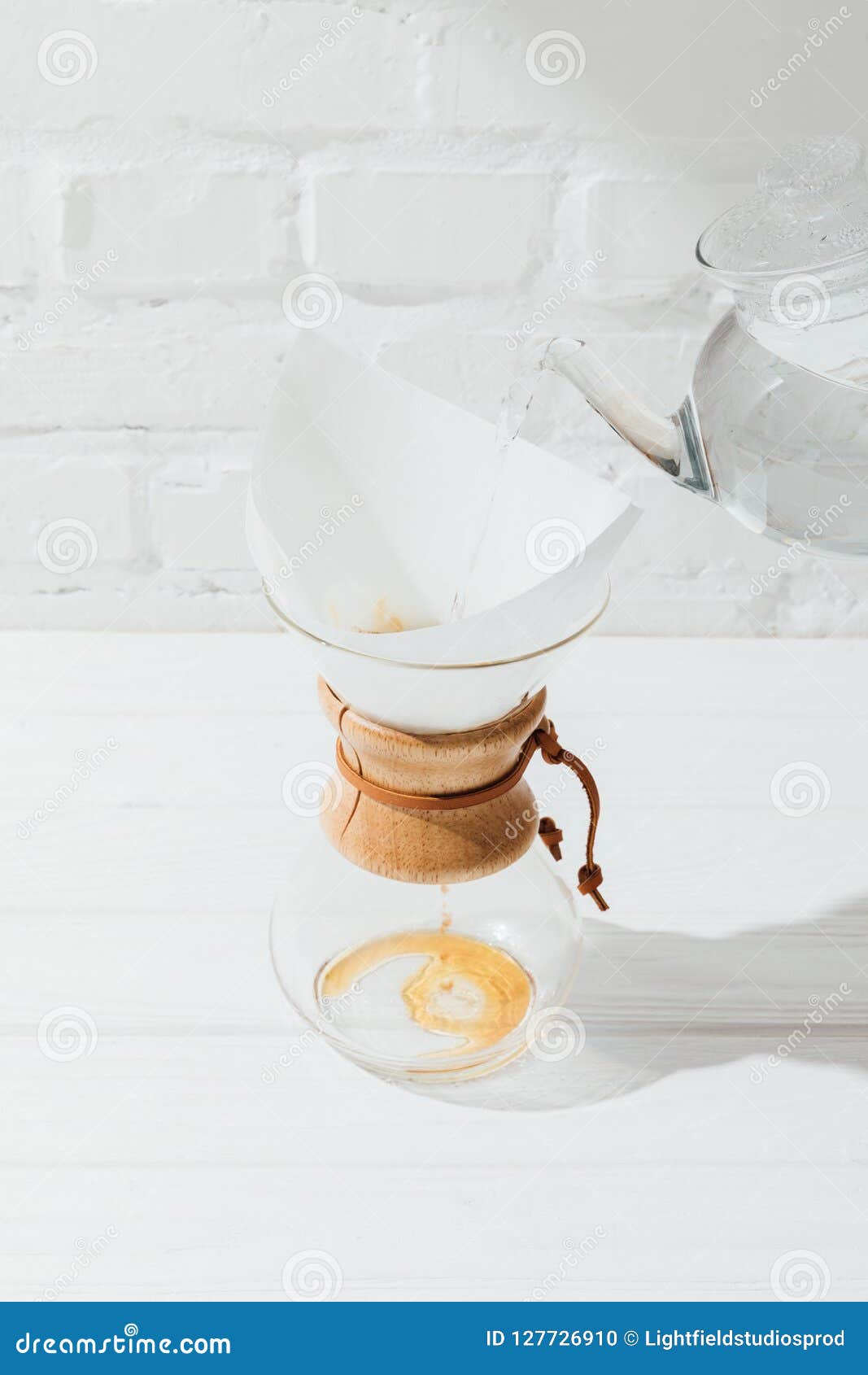 High Angle View of Pouring Hot Water from Kettle into Chemex with